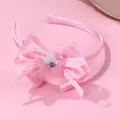 Detail of pink bow headband with sequins and a gemstone center for children - Bow Sequin Flower (HH161) / Pink