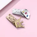 Detailed view of handmade sequin crown and cloud hair clips on pink background - Sequin Crown and Cloud Hair Clips