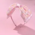 Detail of pink satin headband featuring a layered mesh bow with colorful flower sequins - Pink Sequin Bow Style