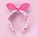 Dettaglio del cerchietto con orecchie di coniglio rosa e tessuto a pois colorati - Rosa
