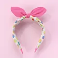 Detalle de diadema rosa con lazo de orejas de conejo, estampado frutal y puntas suaves - Diadema Lazo Rosa
