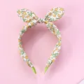 Detail of floral headband with bunny ear bow on pink background with fabric wrapping - Yellow Floral