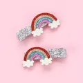 Detail view of glittery rainbow and cloud hair clips for kids on pink background - Rainbow Cloud Style
