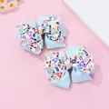 Détail de barrettes à double nœud bleu avec des motifs scolaires mignons pour enfants - Barrette à Nœud Bleu