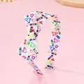 Detail of school-themed bow headband with colorful crayon graffiti on white ribbon - Pencil Style