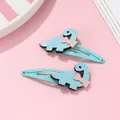 Dettaglio di fermagli per capelli a forma di dinosauro blu con fiocchi rosa per bimbe - Blu