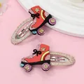 Detalle de pinzas para el pelo de patines con purpurina, estrellas y lazos rosas - Brillo Rojo (Patines)