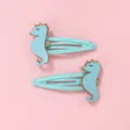 Détail de barrettes hippocampe bleues pour enfants avec paillettes dorées et clips brillants - Bleu