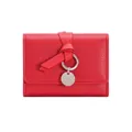 Minimalist red leather tri-fold wallet with strap knot and silver circular metal charm - Red