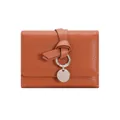 Minimalist caramel brown leather trifold wallet with decorative knot and silver pendant - Brown