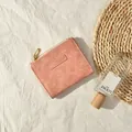 Pink faux leather short wallet with MO MO DOG logo and gold zipper on linen - Deep Pink