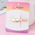 Creative cleaver-shaped golden hair clip with blue cloud and pink flower detail - Fruit Knife Matte Gold Hch253-2
