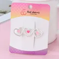 Pink heart-shaped hair clip with silver alloy base on a decorative card display - Hollow Heart Matte Silver Hch255-1