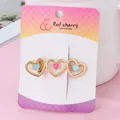 Sweet golden alloy heart hair clip with pink and blue enamel detailing on display card - Hollow Heart Matte Gold