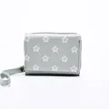 Short mint green women's wallet with pink star patterns and a matching wrist strap - Green
