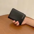 Classic black short PU leather bifold wallet for men with textured finish and card slots - Black