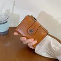 Portafoglio vintage marrone da donna con fibbia a margherita e dettagli traforati - Marrone