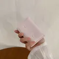 Rosa Kunstleder-Geldbeutel mit Schleife und Perle im kompakten Falt-Design - Rosa