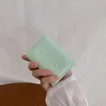 Kompakte mintgrüne Damenbrieftasche mit Schleife, Perle und Falt-Design - Grün