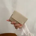 Minimalist cream short leather wallet for women with golden rivet snap closure - Beige