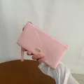 Elegant pink long wallet for women with gold logo, zipper closure and wrist strap - Light Pink