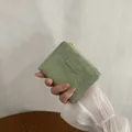 Retro moss green bi-fold wallet for women with elegant textured finish and zip closure - Green