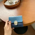 Women's small wallet in blue color-block leather with golden buckle and folding design - Blue