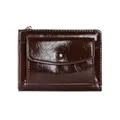 Detail of dark brown faux leather wallet featuring a snap button pocket and top zipper - Coffee