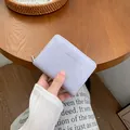 Short lavender lavender leather wallet with vertical embossed stripes and silver zipper - Light Purple
