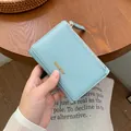 Short tri-fold light blue litchi pattern wallet with golden Classic Star logo - Light Blue