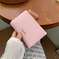 Short tri-fold pink leather wallet for women with lychee texture and gold logo - Light Pink
