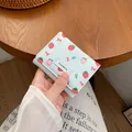 Short tri-fold white PU leather wallet featuring strawberry and red bow patterns - Light Blue