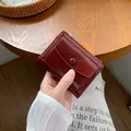Compact wine red leather wallet for women with zipper pocket and snap button closure - Burgundy
