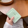 Portafoglio verde chiaro in pelle PU con cerniera, fiocco e cuciture decorative a U - verde chiaro