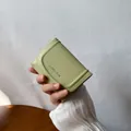 Short avocado green bifold wallet for women with classic star logo and premium leather texture - Light Green