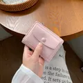 Compact light pink women's short wallet with lychee pattern and snap button closure - Pink