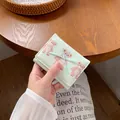 Portafoglio donna verde menta a tre ante con stampa orsetti e fiocco decorativo - verde chiaro