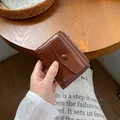Short brown oil-wax leather wallet for women with zip closure and snap button flap - Brown
