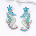 Seahorse dangle earrings with blue starfish tops and colorful crystal rhinestone inlay - Starfish Seahorse Style / Teal