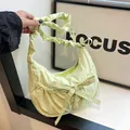 Light green pleated crescent nylon crossbody bag with cloud-like drawstring strap and bow - Green
