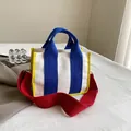 Canvas tote bag in white with blue straps and red shoulder strap in a color-block style - Blue