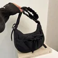 Chic black quilted hobo bag with a decorative bow and gathered handle for women - Black