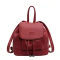 Mini red faux leather backpack with drawstring closure and top handle in a solid finish - Burgundy