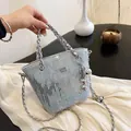 Light blue denim bucket bag with silver sequins, chain handle and balloon dog charm - Sequin Light Blue