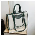 Detail of canvas tote bag showing side view with green leather trim and large capacity - Green