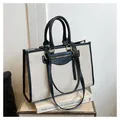 Bolso tote de lona beige con ribete de cuero negro y correa larga ajustable - Negro