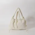 Creamy white quilted puffer tote bag with drawstring closure and dual handle straps - White