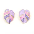 Macro detail of gold-plated monstera leaf earrings with purple and pink enamel inlay - Purple
