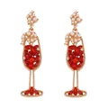 Detailed view of wine glass earrings with red rhinestones and faux pearls in gold - Red