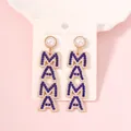 Golden MAMA drop earrings with blue rhinestones and white pearls on display card - Blue